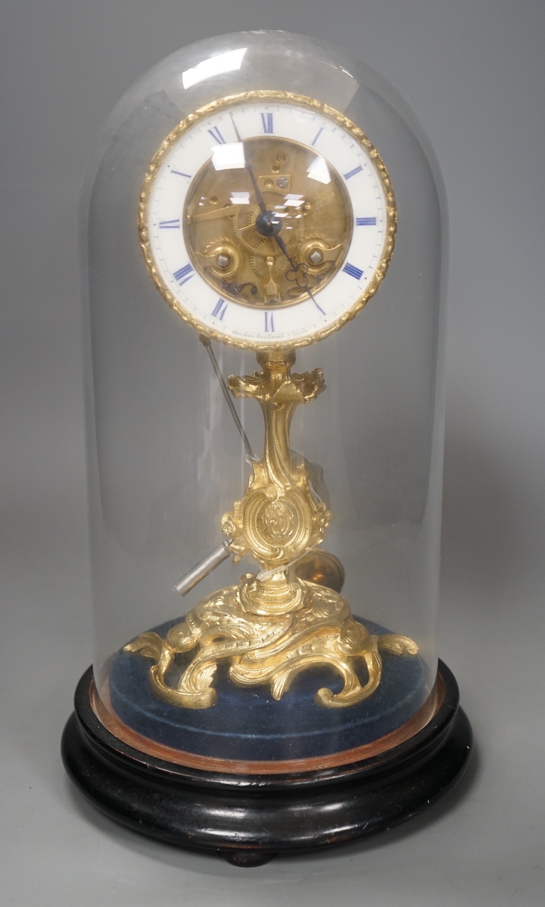 A French Grignon-Meusnier of Paris ormolu clock under dome, with key and pendulum